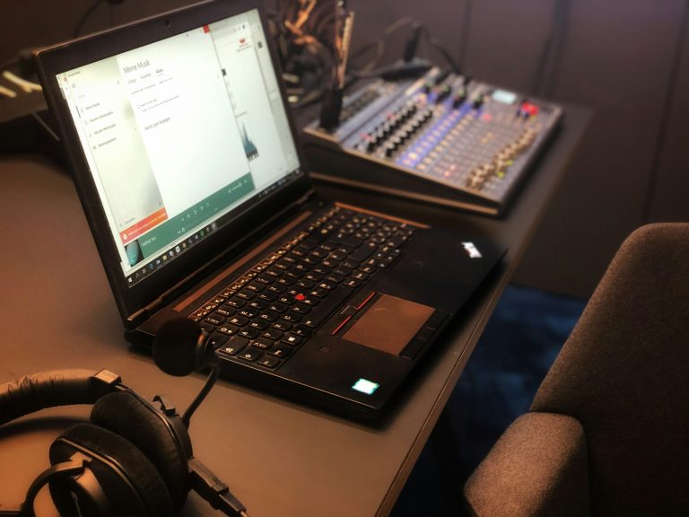 a laptop computer sitting on top of a desk